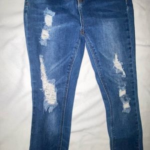 Size 24 skinny ripped jeans .